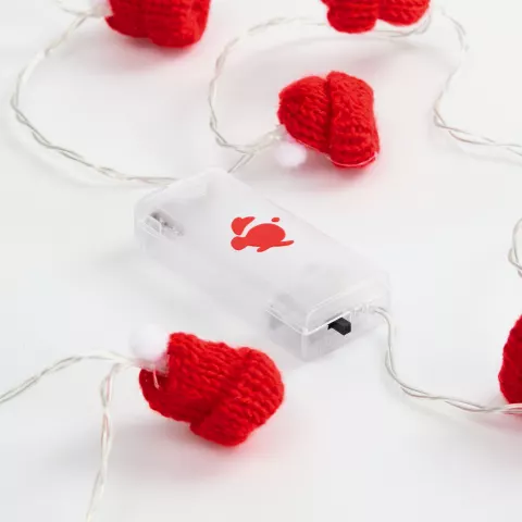 УФ-DTF: Гирлянда Cosy Poms — пример нанесения логотипа