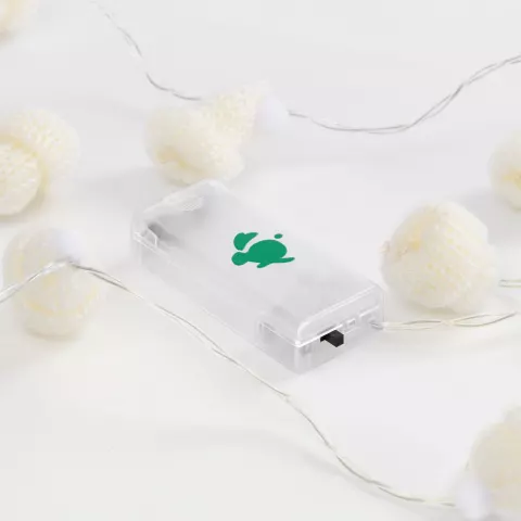УФ-DTF: Гирлянда Cosy Poms — пример нанесения логотипа