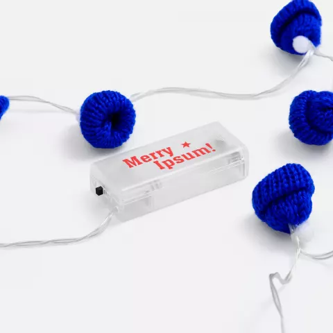 УФ-DTF: Гирлянда Cosy Poms — пример нанесения логотипа